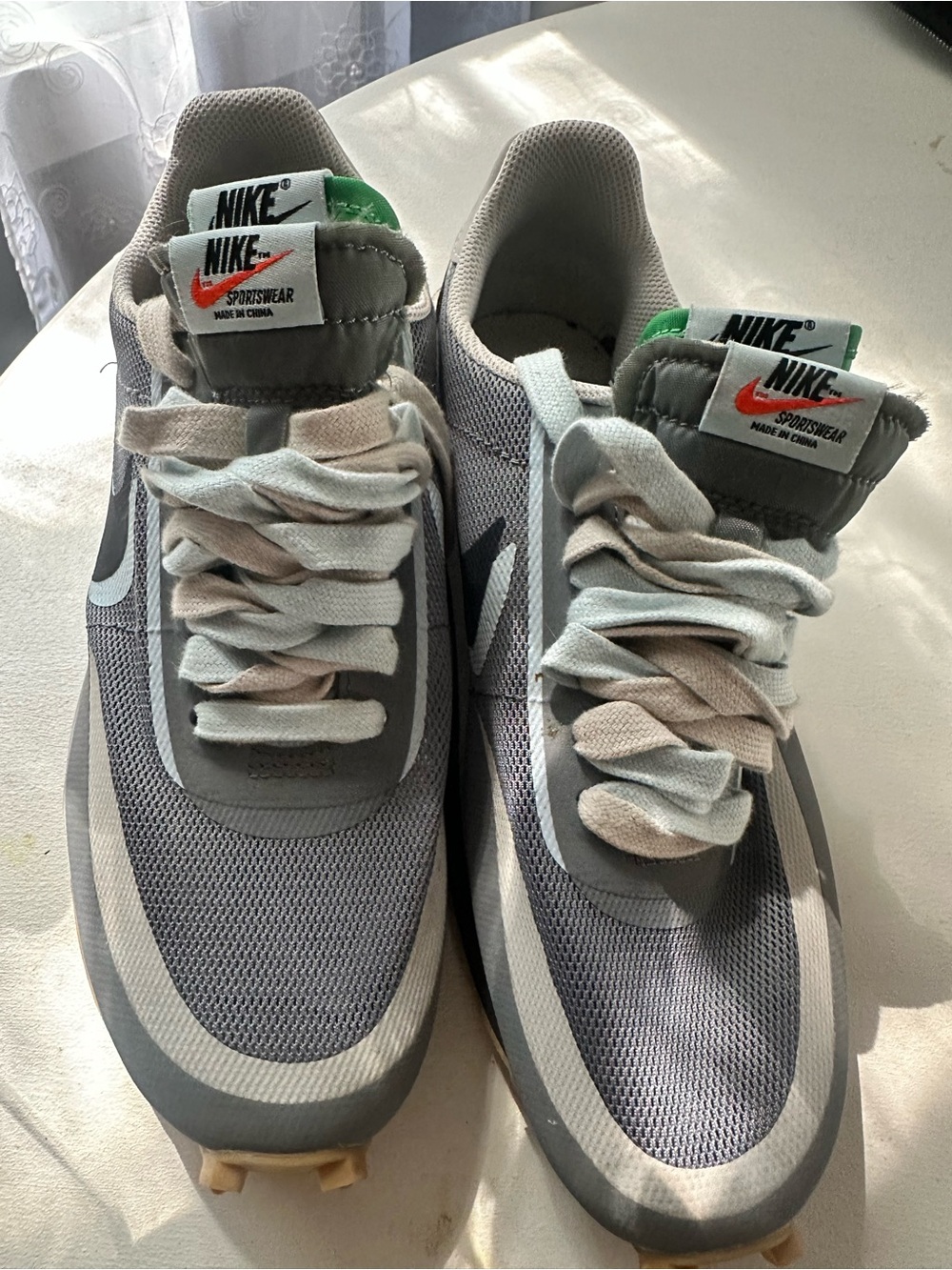 Nike Men's Gray and White Mesh Sneakers with Orange Swoosh